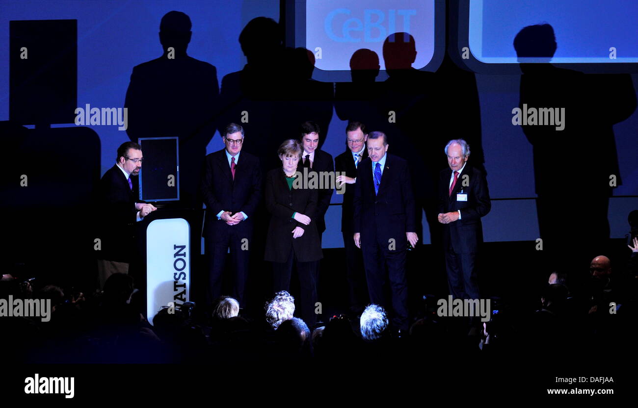 German Chancellor Angela Merkel (3-l), the head of IBM Sam Palmisano (l-r), Lower Saxony's Prime Minister David Mc Allister, the first mayor of Hanover Stephan Weil, Turkish Prime Minister Recep Tayyip Erdogan and BITKOM President August-Wilhelm Scheer attend the inauguration of the Cebit Computer Expo in front of the supercomputer Watson, which is presented by IBM employee David F Stock Photo