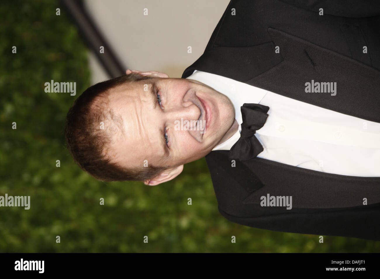 British actor Ralph Fiennes arrives at the Vanity Fair Oscar Party at