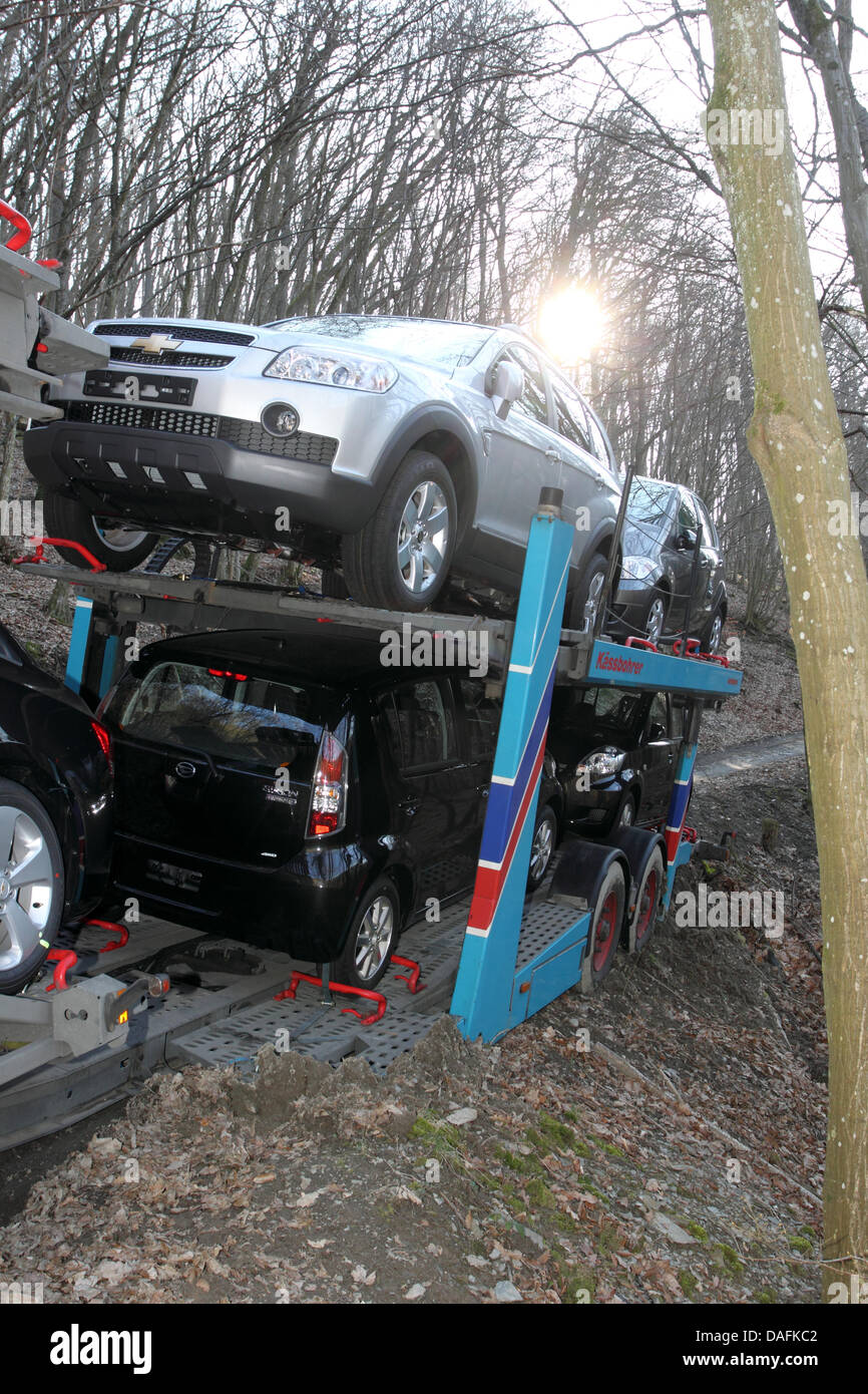 A car transporter parks in a wood near Greimersburg, Germany, 02 March 2011. The car transporter's driver relied on his satnav that obviously sent him the wrong way. Photo: THOMAS FREY Stock Photo