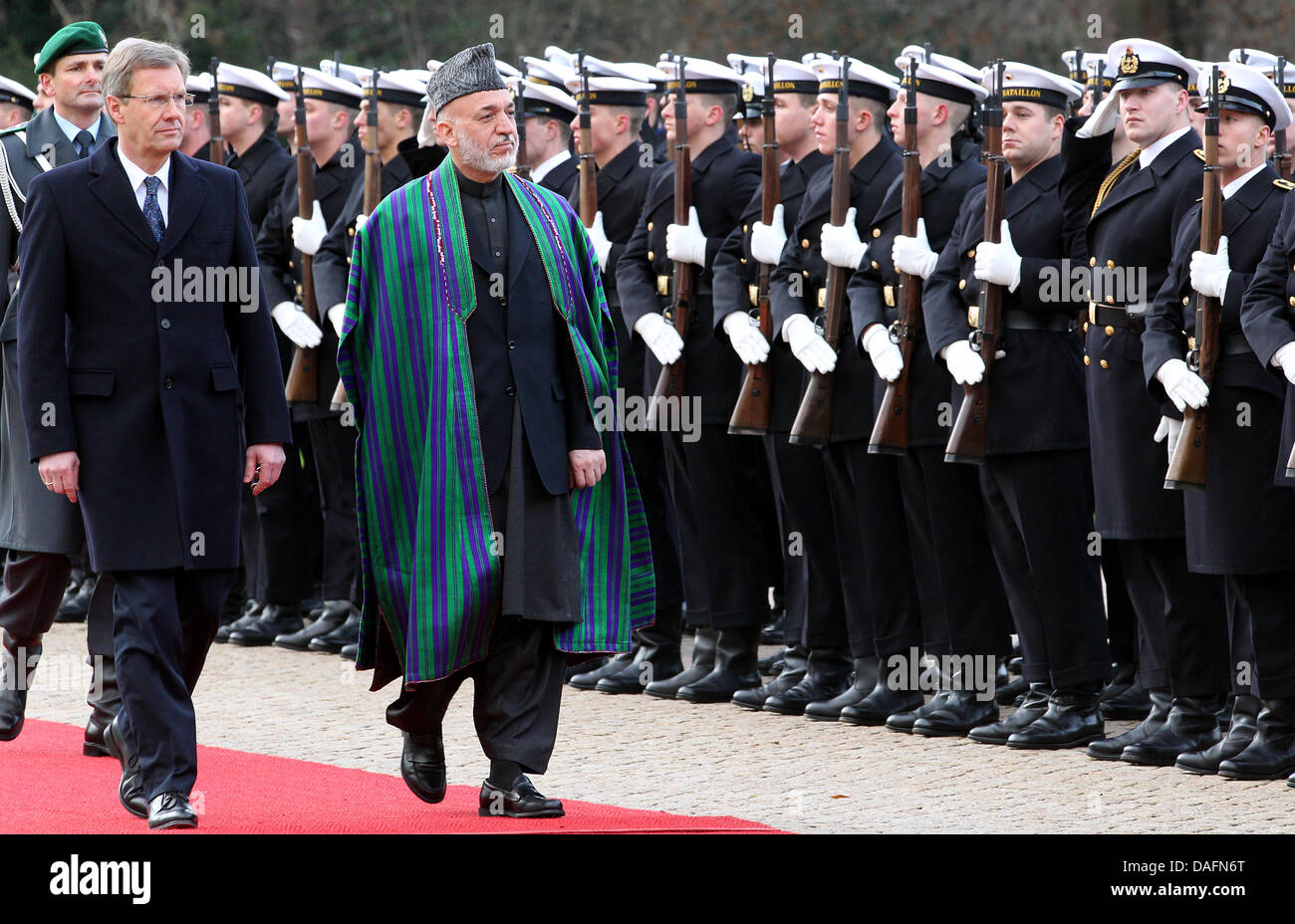 Afghanistan President Hamid Karsai is welcomed by German President Christian Wulff (L) with military honours at Bellevue Palace in Berlin, Germany, 06 December 2011. Karsai is on a one-day visit to the German capital. Photo: WOLFGANG KUMM Stock Photo