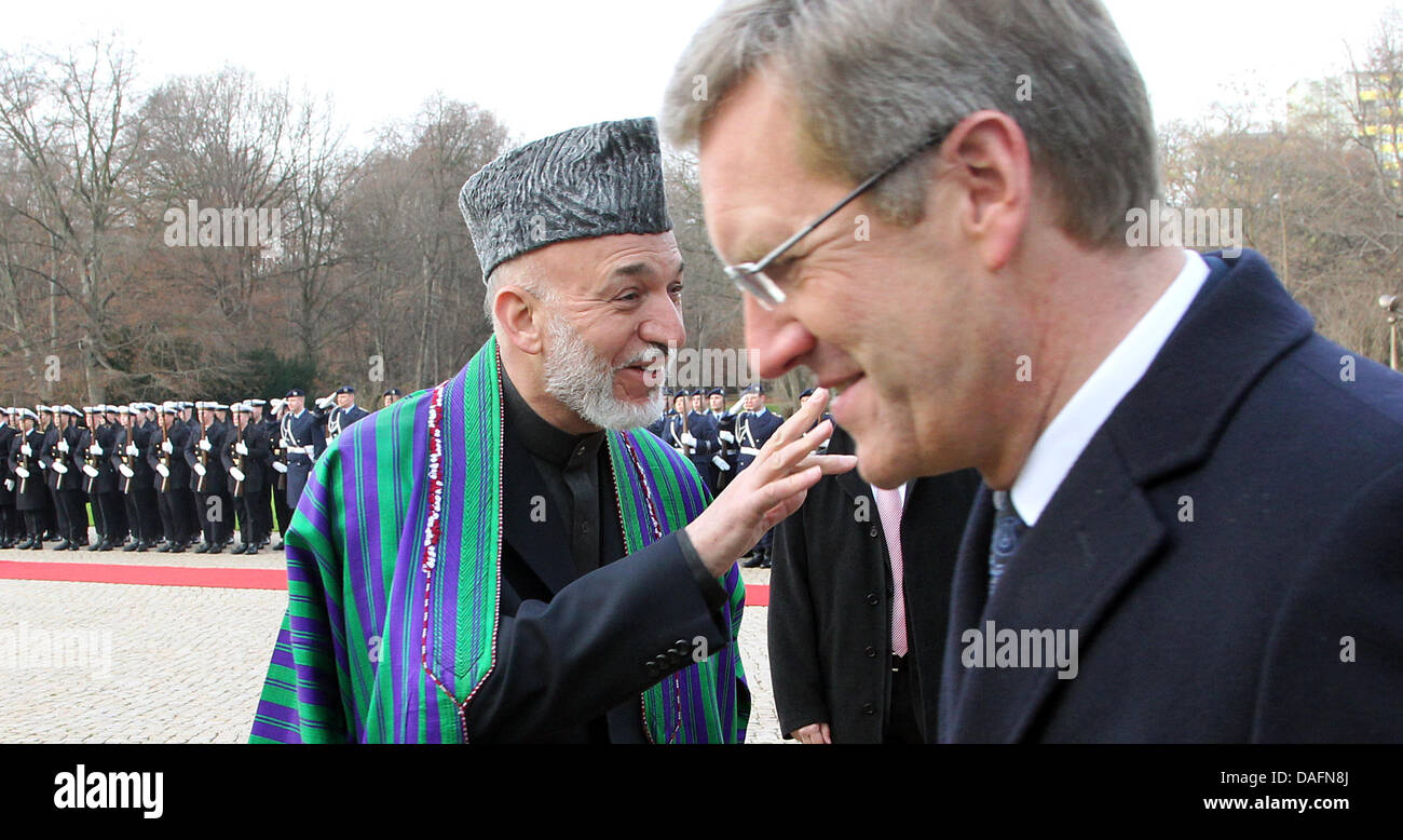 Afghanistan President Hamid Karsai is welcomed by German President Christian Wulff (R) in front of Bellevue Palace in Berlin, Germany, 06 December 2011. Karsai is on a one-day visit to the German capital. Photo: WOLFGANG KUMM Stock Photo