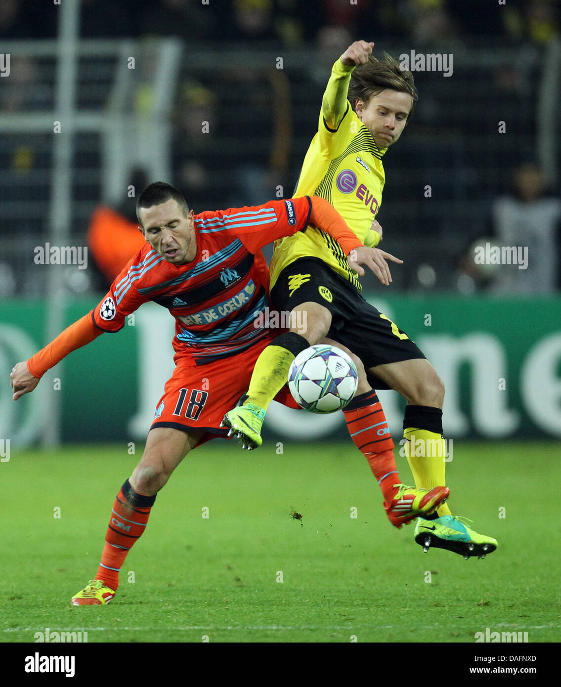 Dortmund's Chris Loewe (r) and Marseille's Morgan Amalfitano (l) vie for the ball during the Champions League group F soccer match between Borussia Dortmund and Olympique Marseille at the BVB Arena in Dortmund, Germany 06 December 2011. Photo: Friso Gentsch dpa/lnw Stock Photo