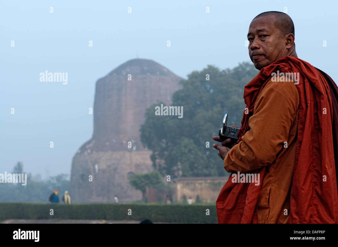 Monk in Dhamekh stupa complex. Sarnath, Uttar Pradesh, India Stock Photo