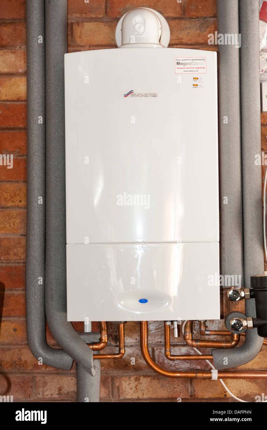 Gas combi boiler made by Worcester 30si heats water & central heating radiators, UK. Stock Photo