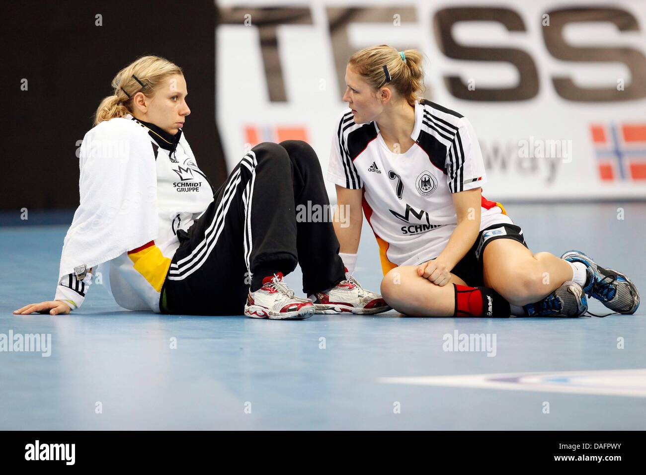 Germany's Katja Schuelke (L) and Natalie Augsburg sit in disappointment