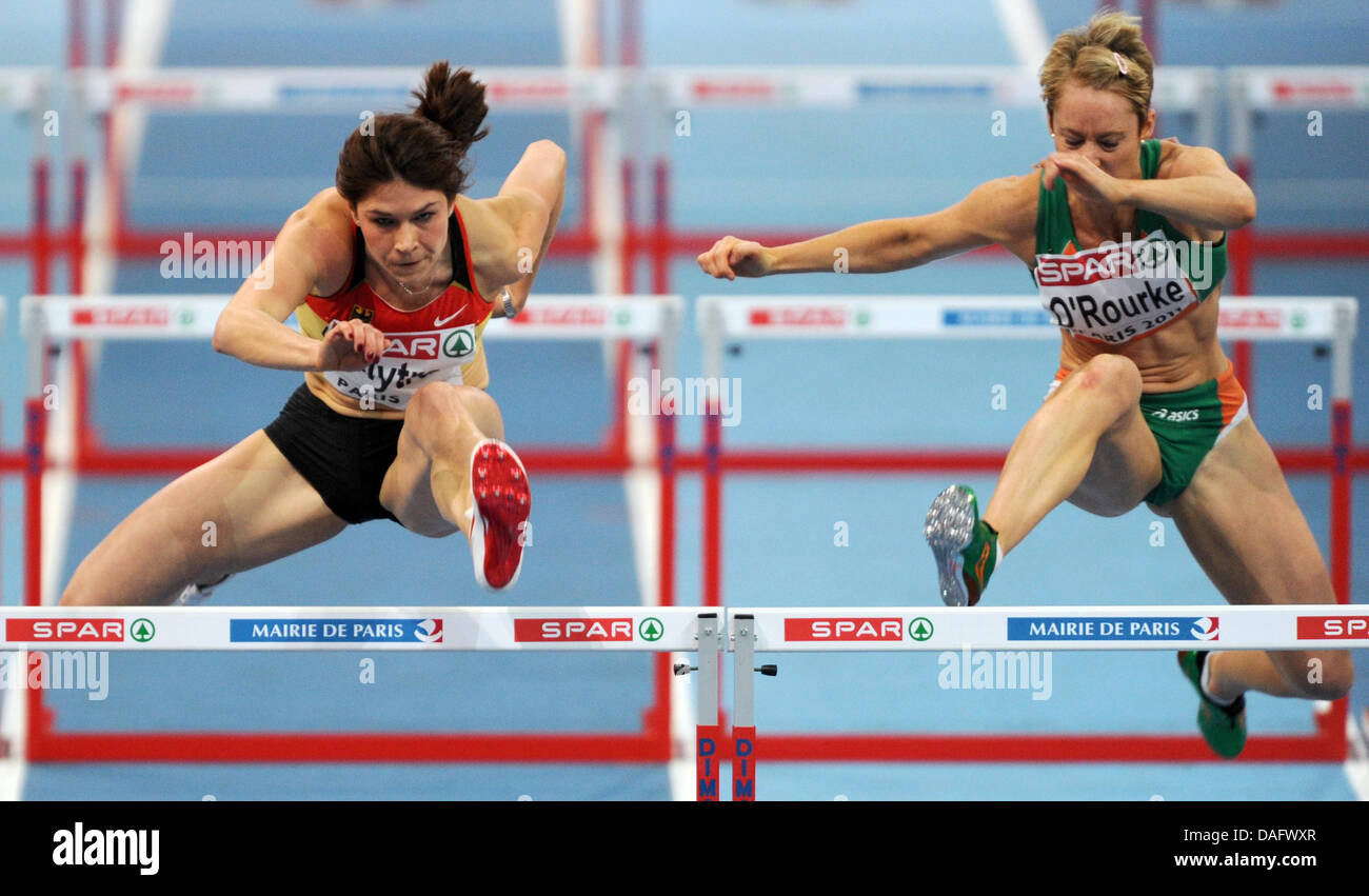 Cermany's Carolin Nytra (L) and Ireland's Derval O'Rourke (R) take a hurdle during 60m Hurdles prelim heat at the European Athletics Indoor Championships 2011 in Paris, France, 04 March 2011. Photo: Arne Dedert Stock Photo