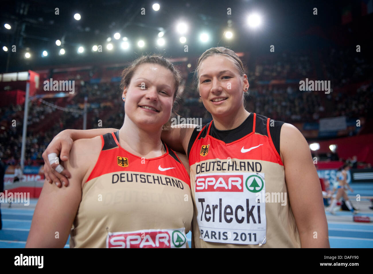 German athletes Christina Schwanitz (L) and Josephine Terlecki are pictured after the women's shot put finals of the European Athletics Indoor Championships at the Palais Omnisports in Paris, France, 05 March 2011. Schwanitz took second place and Terlecki won the bronze medal. Photo: Bernd Thissen Stock Photo