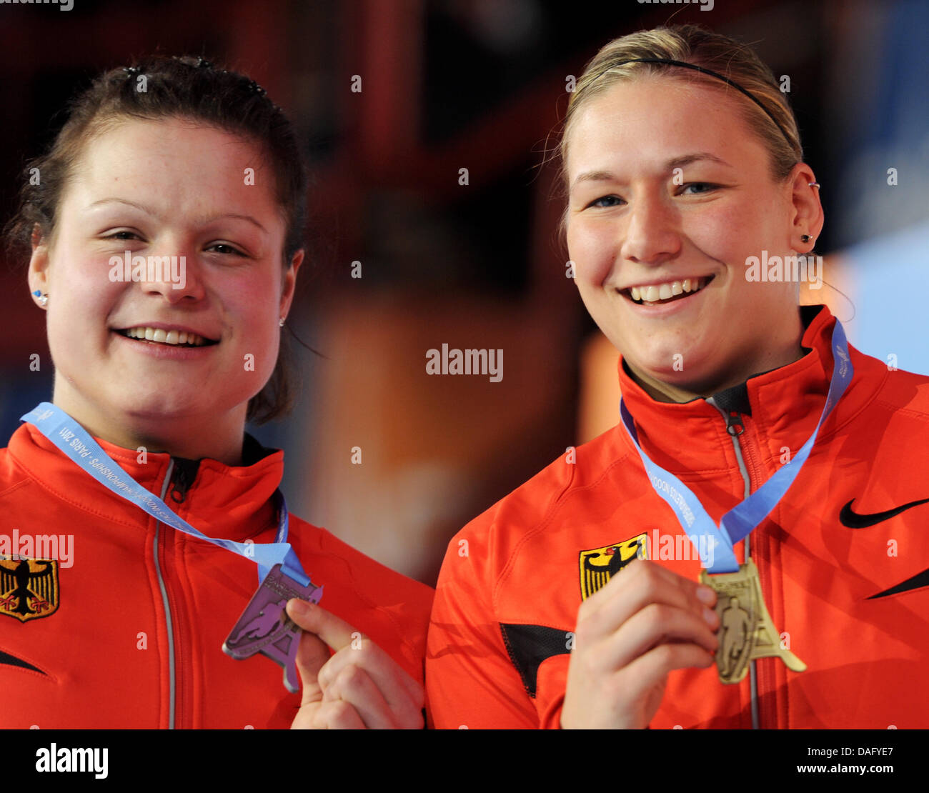 (L-R) Germany's Christina Schwanitz (silver) and Germany's Josephine Terlecki (bronze) smile with their medals won in the shotput competition at the European Athletics Indoor Championships 2011 in Paris, France, 05 March 2011. Photo: Arne Dedert Stock Photo