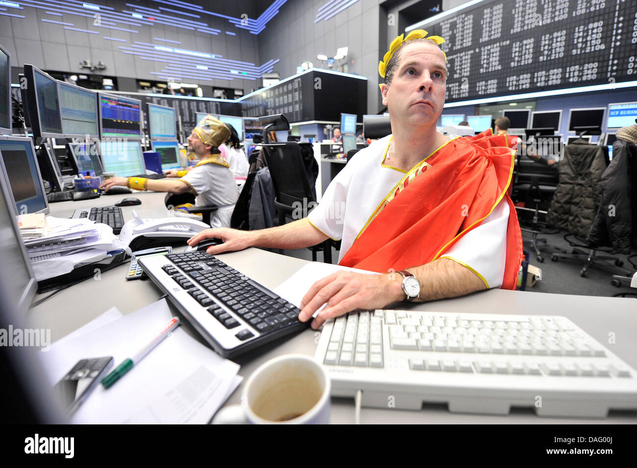 Dressed-up brokers smile at the traditional stock exchange carnival in  Frankfurt Main, Germany, 08 March 2011. Every year, brokers trade in  costumes on the floor of Frankfurt Stock Exchange. Photo: MARIUS BECKER