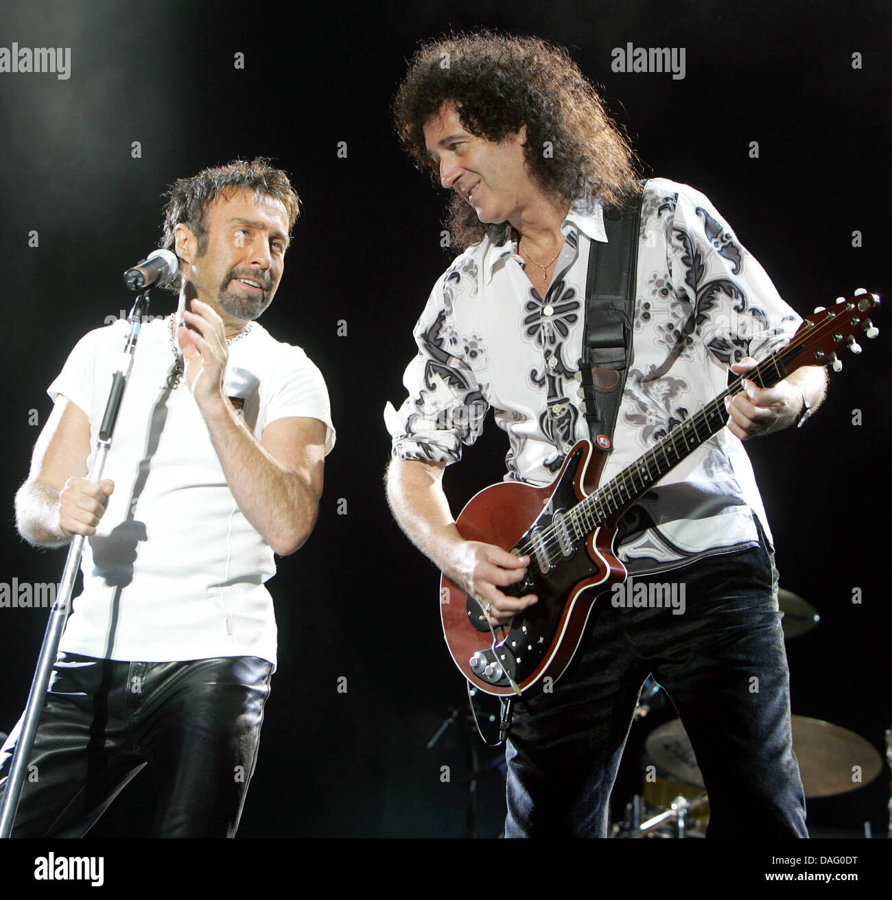 (dpa file) A file picture dated 06 July 2005 showing Queen member Brian May (R) and singer Paul Rodgers (L) in Cologne, Germany. For many fans Queen died along with Freddie Mercury in November 1991. Gut guitarrist Brian May and percussionist roger Taylor continued the band and are now celebrating Queen's 40th birthday. Photo: Rolf Vennenbernd Stock Photo