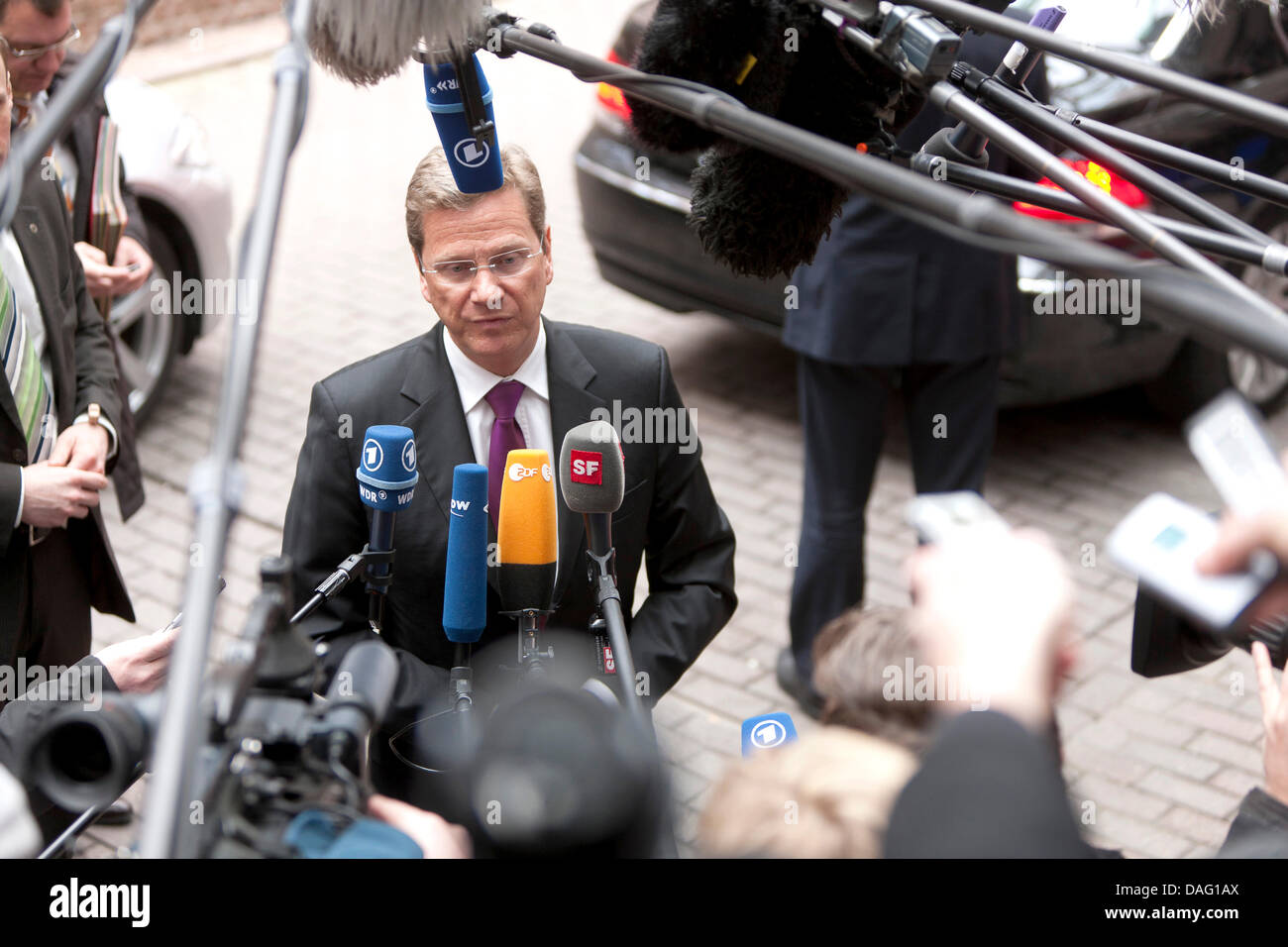 The German Minister for foreign affairs Guido Westerwelle is talking to media as he arrives for a Foreign affairs EU Ministers Council in Brussels, Belgium on March 10, 2011. Photo: Thierry Monasse Stock Photo