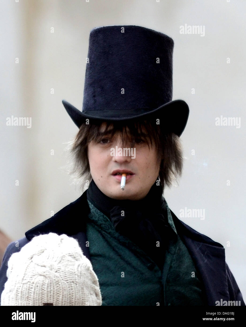 The picture shows the British singer Pete Doherty  smoking a cigarette at a shooting for the movie 'Confessions of a Young Contemporary' in Suenching, Germany on 10 March 2011. The scandalous rock musician, aged 31, is currently under suspicion of having collaborated in the burglary of a music store in Regensburg, Germany, which happened on tuesday morning. One guitar and one recor Stock Photo