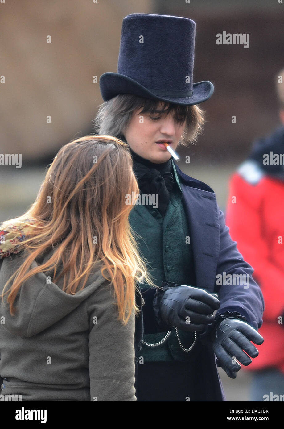 The picture shows the British singer Pete Doherty   smoking a cigarette at a shooting for the movie 'Confessions of a Young Contemporary' in Suenching, Germany on 10 March 2011. The scandalous rock musician, aged 31, is currently under suspicion of having collaborated in the burglary of a music store in Regensburg, Germany, which happened on tuesday morning. One guitar and one reco Stock Photo