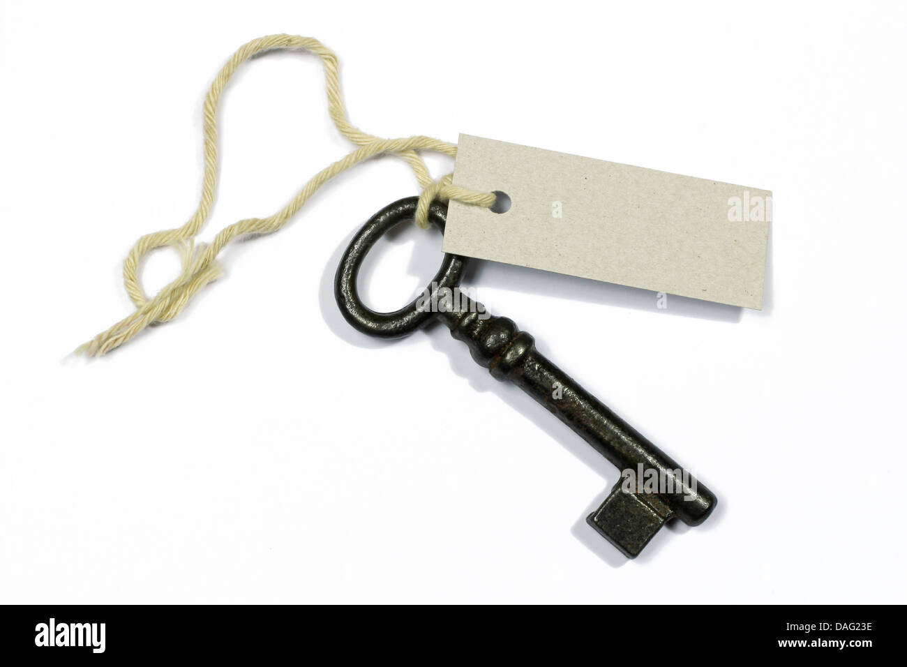 old key with blank label on white background Stock Photo - Alamy