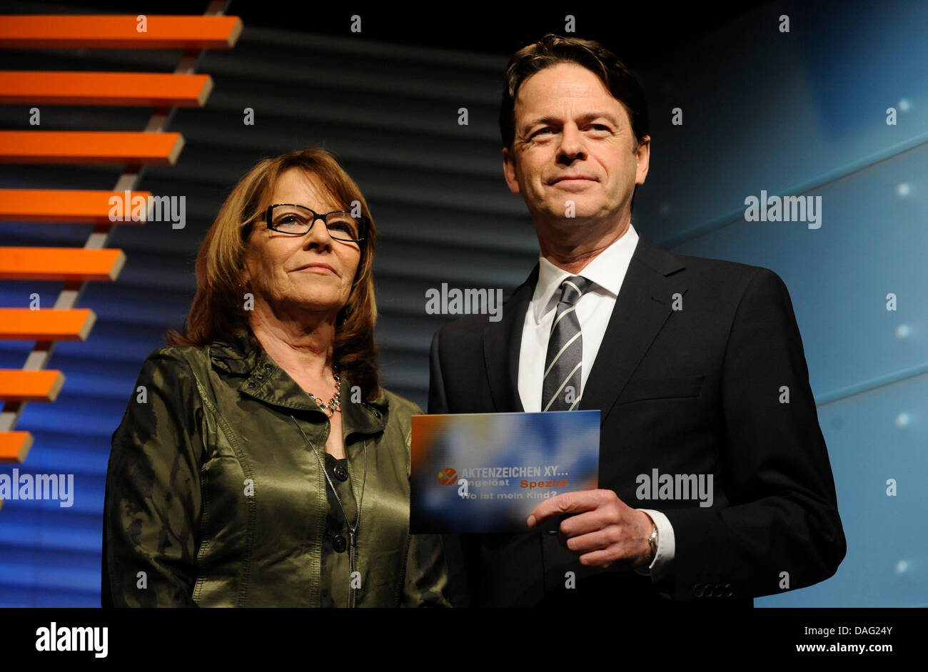 Brigitte Sirny-Kampusch (L), the mother of Natascha Kampusch, stands next to Rudi Cerne, host of German crime prevention show  'Aktenzeichen XY... ungeloest' (File Reference XY   Unsolved) of the ZDF public television broadcaster, in a special edition of the show titled 'Where is my child' in Munich, Germany, 11 March 2011. The show aims to solve crimes with the help of the public. Stock Photo