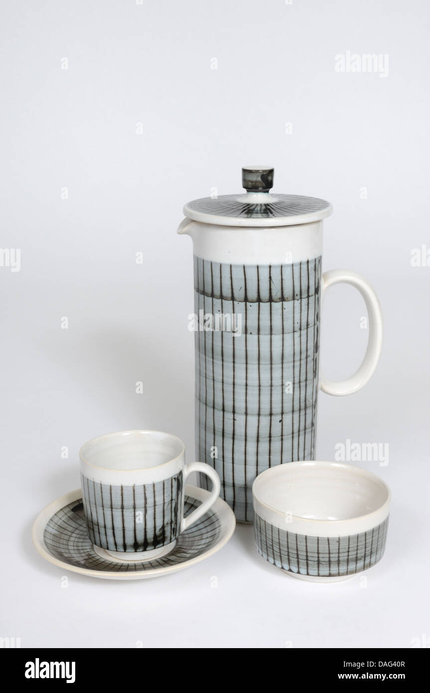 An English Briglin Pottery coffee pot,  cup, saucer and sugar bowl, with linear wax resist design Stock Photo