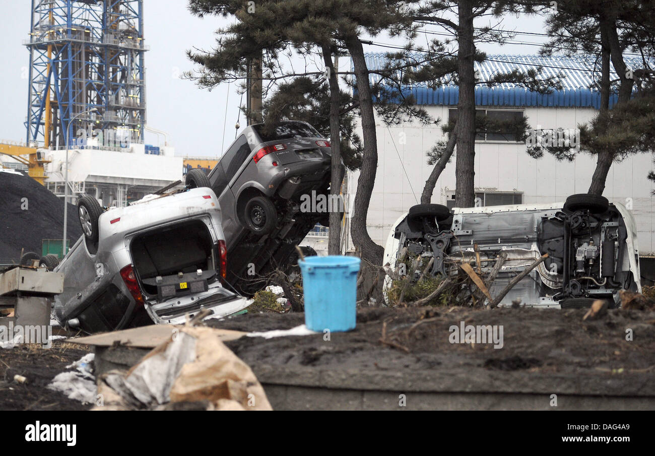 Several cars are destroyed and scattered across the area of the harbour of Hachinohe after the Tsunami in the north-east of Japan, 17 March 2011. Photo: Hannibal Stock Photo
