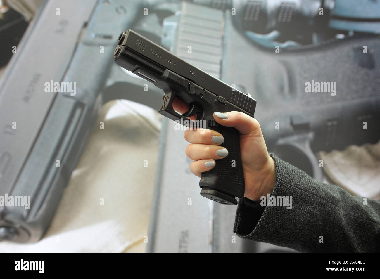 The picture shows a female hand holding a gun of the make 'Glock 17 Gen4'  at the Hunting and Sports`Weapons' Fair IWA & Outdoor Classics in  Nuremberg, Germany on 11 March 2011.