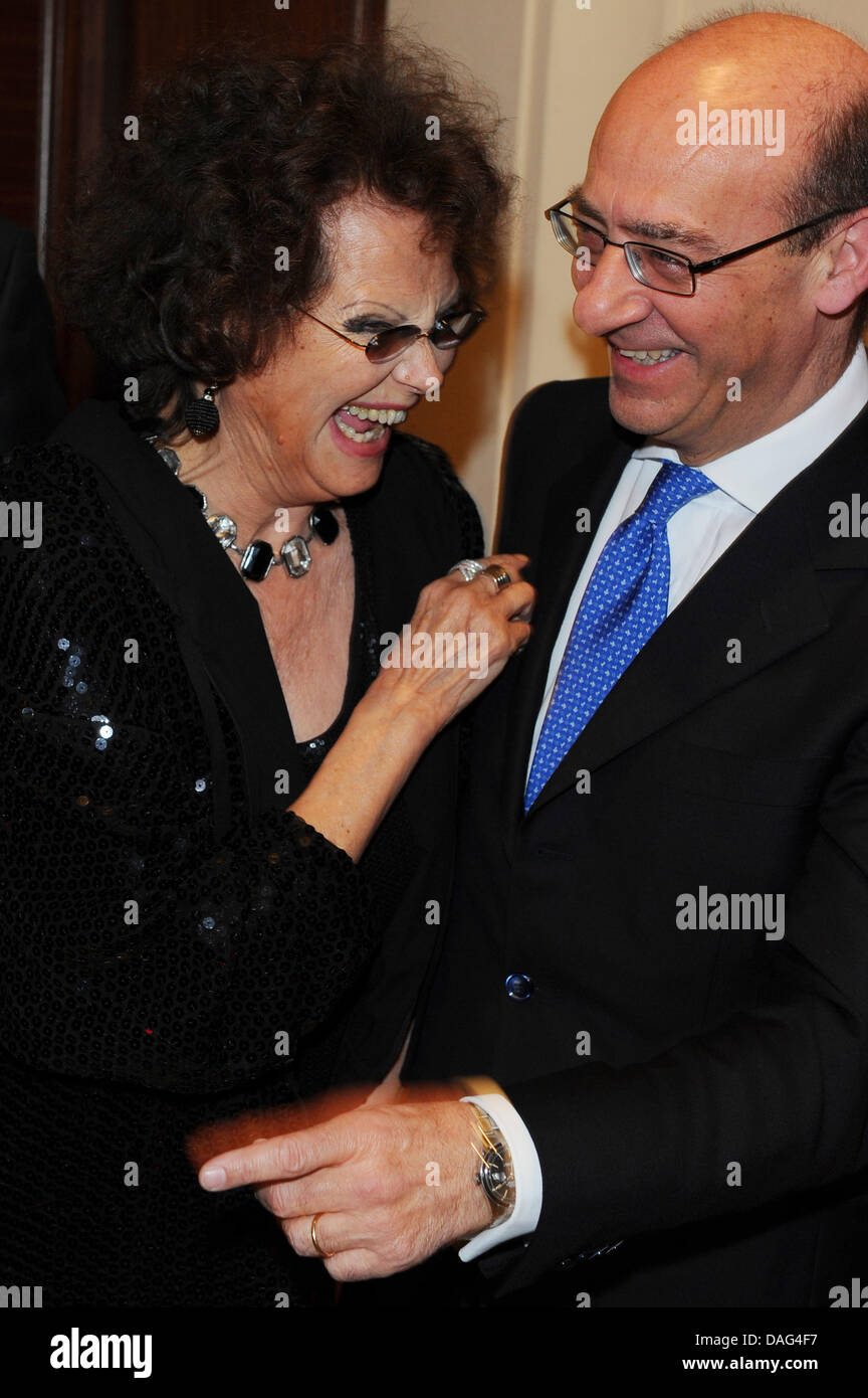 The picture shows the Italian actress Claudia Cardinale (L) and the Italian Embassador Michele Valensise (R) at a film screening and reception at the Italian Embassy in Berlin, Germany on 17 March 2011. On the occasion of Italy's 150th anniversary the film 'Il Gattopardo' (The Leopard) was shown, in which Cardinale plays the lead. PHOTO: JENS KALAENE Stock Photo