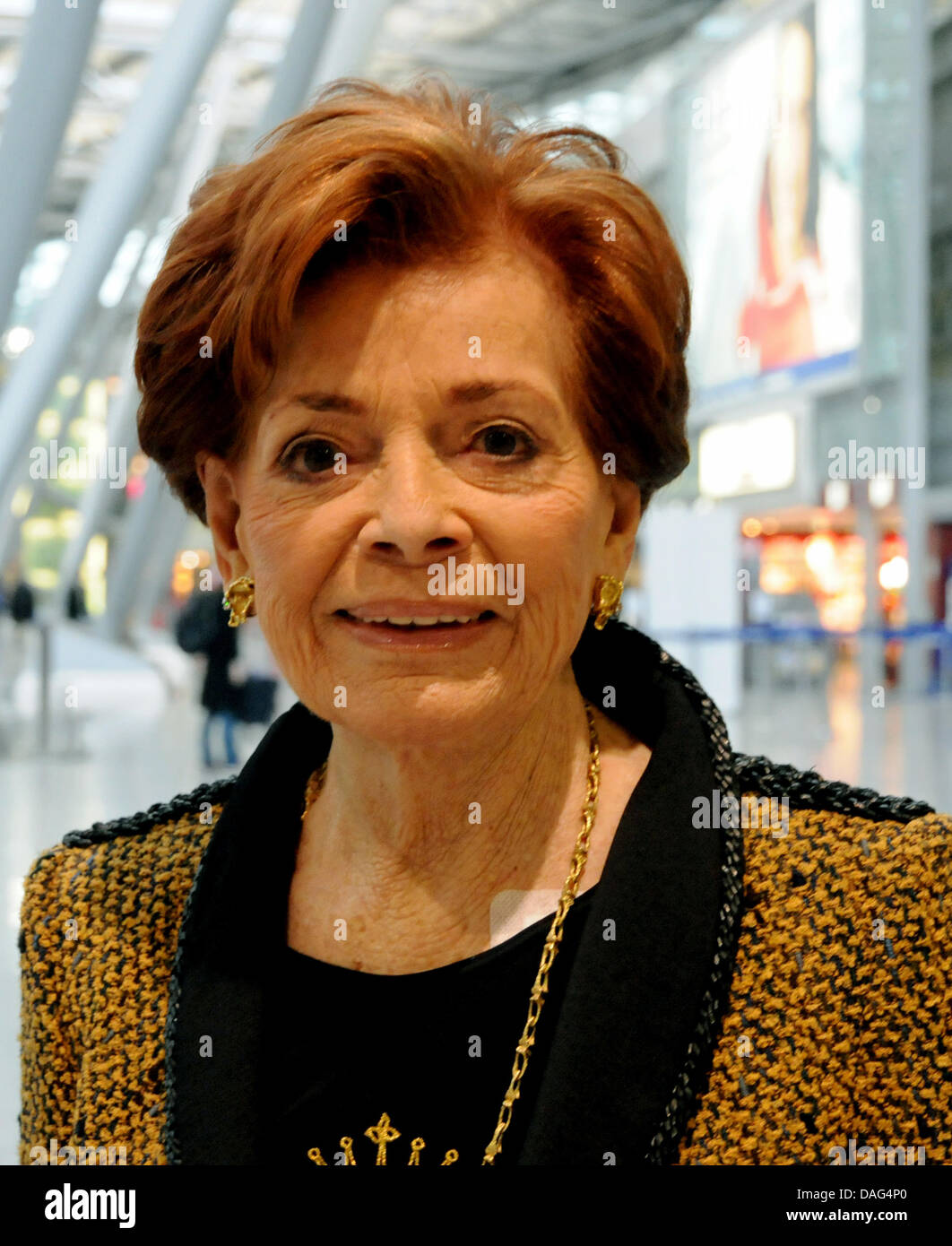 Swiss singer Lys Assia (87), the first Grand Prix winner from 1956, poses with flowers at the airport in Duesseldorf, Germany, 18 March 2011. Assia talked about her Grand Prix de la Eurovision song contest experience during a press conference with the mayor of Duesseldorf, Elbers. Photo: Horst Ossinger Stock Photo