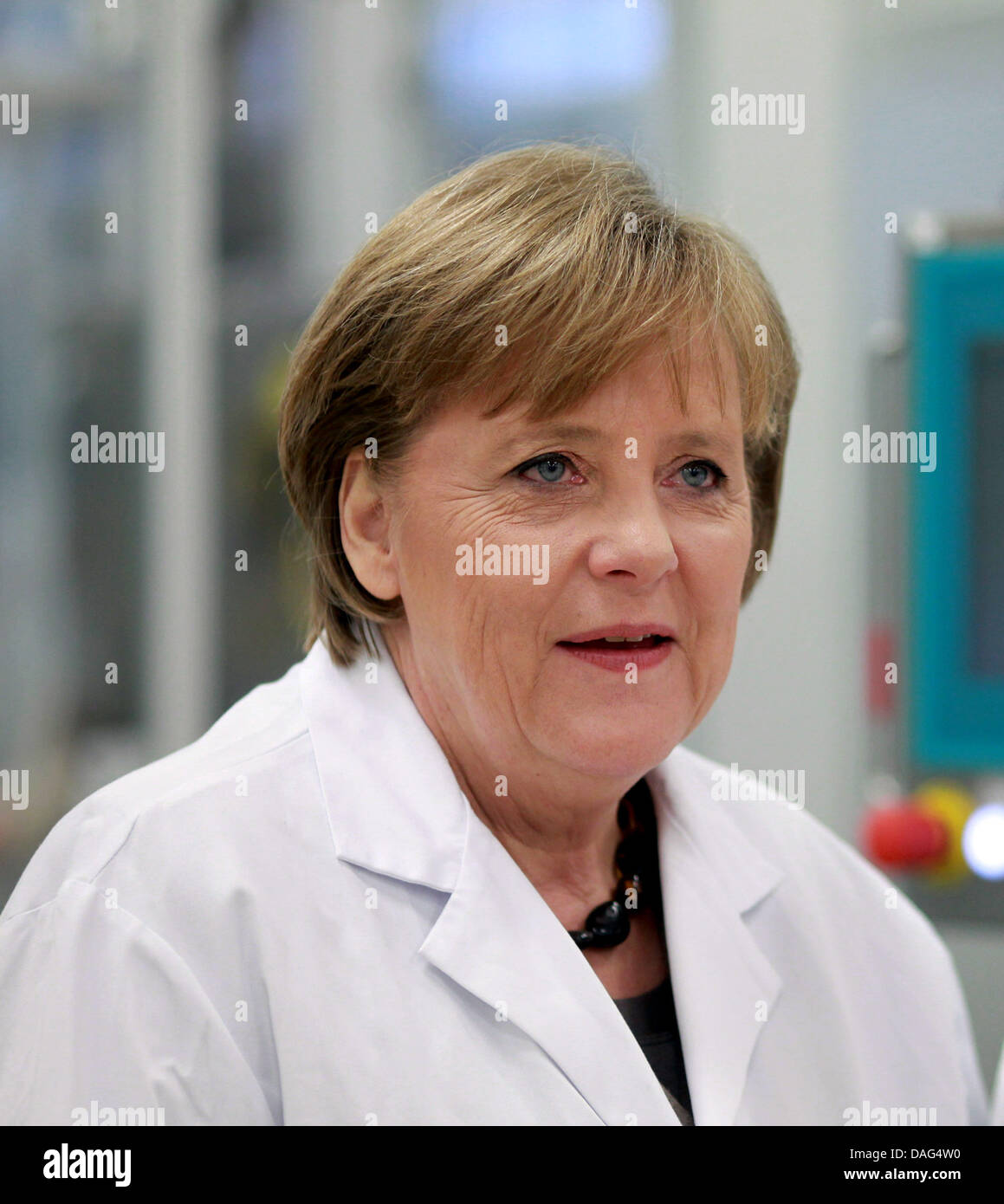 German Chancellor Angela Merkel  visits the IDT Biologika GmbH pharma company at the Pharmapark in Dessau, Germany, 18 March 2011. The pharma company plans on creating 160 new jobs. Until the end of 2012, they will invest 85 million Euro. New buildings are to be constructed in the next few months. Photo: Jens Wolf Stock Photo