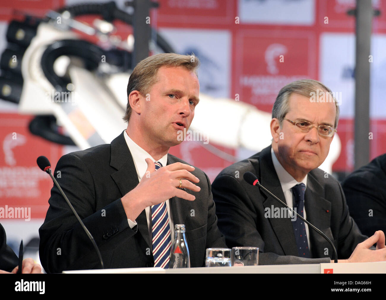Wolfram von Fritsch (l-r), head of the board of directors of the Messe AG, French ambassador Maurice Gourdault-Montagne attend a press conference for the Trade Fair in Hanover, Germany, 22 March 2011. The Hanover Trade Fair takes place from 4 to 8 April 2011 with this year's partner country France. Under the headline 'smart Efficiency', 13 international exhibitons for the sectors I Stock Photo