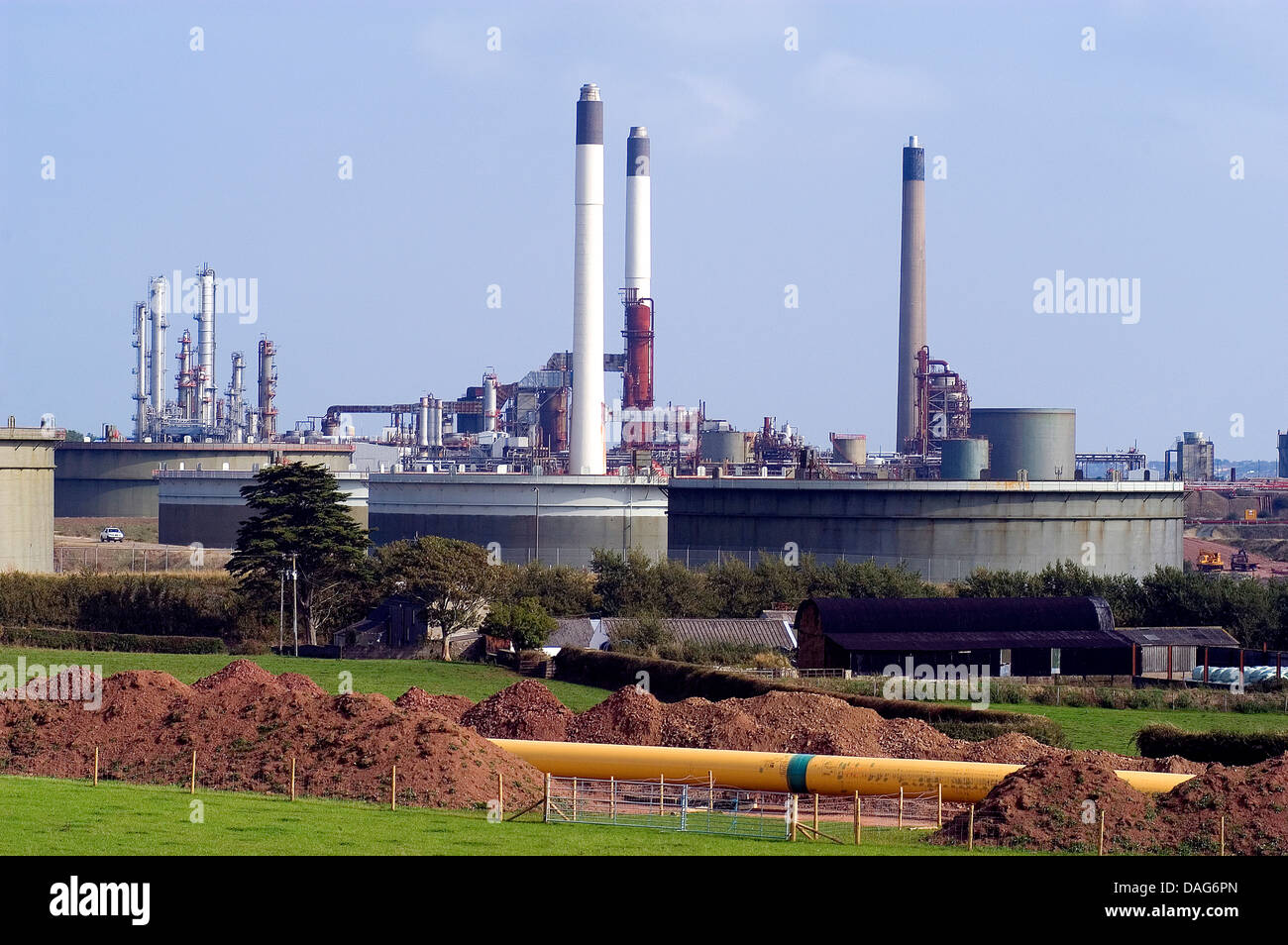 laying LNG pipeline running from Milford Haven to England, oil refinery and LNG terminal in the backgrpund, United Kingdom, Wales, Pembrokeshire Stock Photo