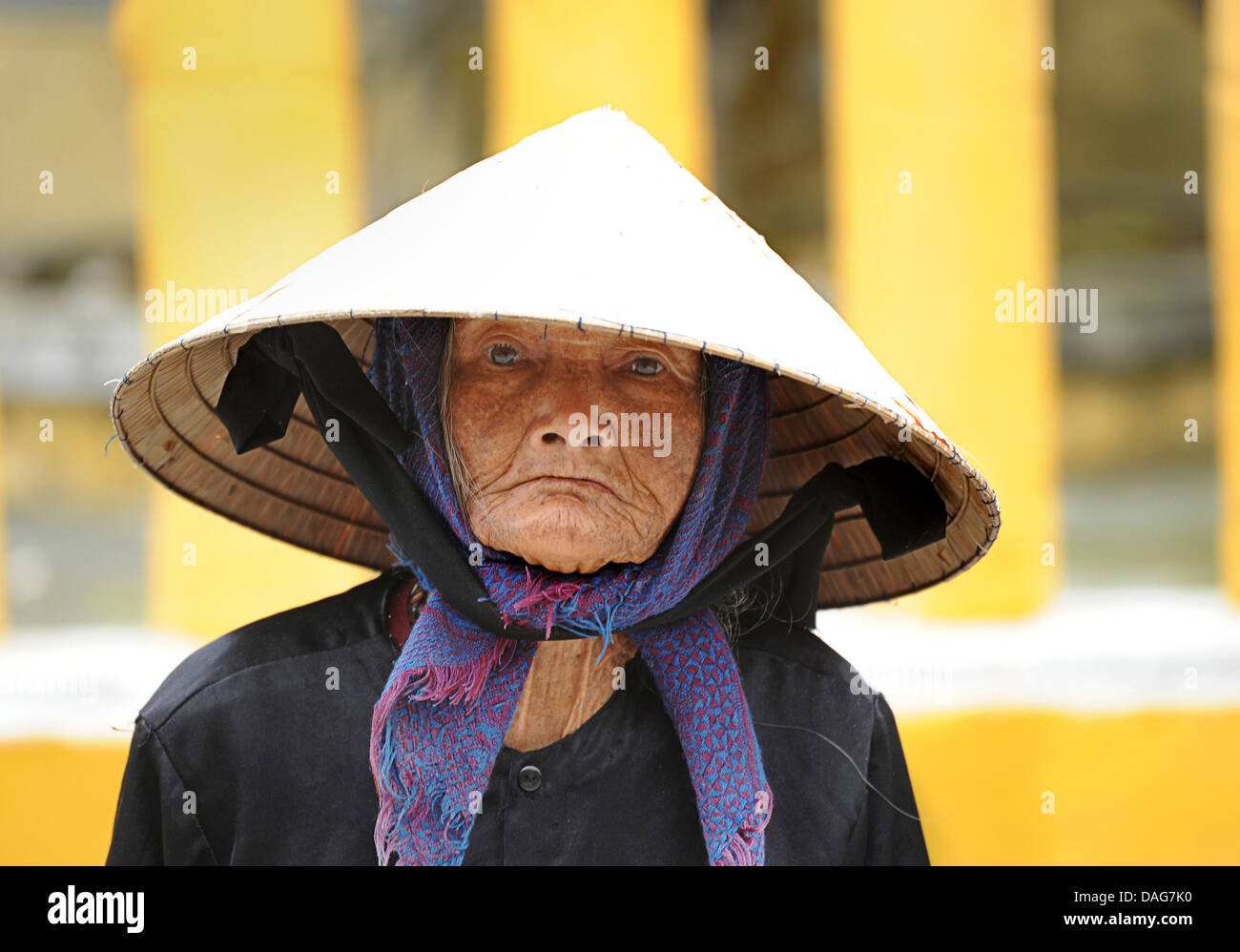 Vietnamese woman in distinctively Vietnamese hat, Hoi An, Vietnam Stock