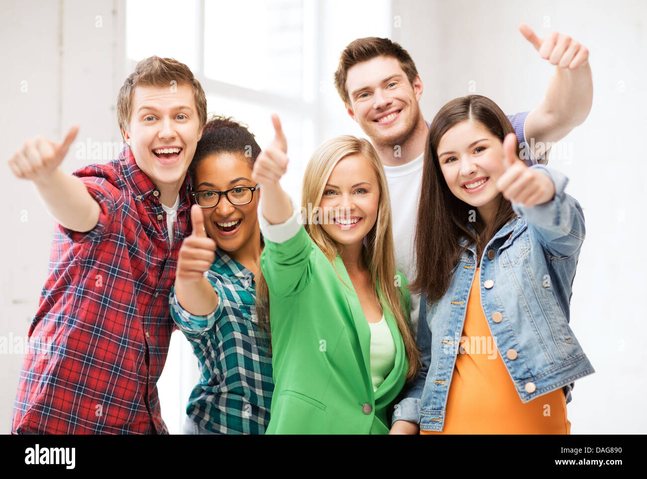 students showing thumbs up at school Stock Photo - Alamy