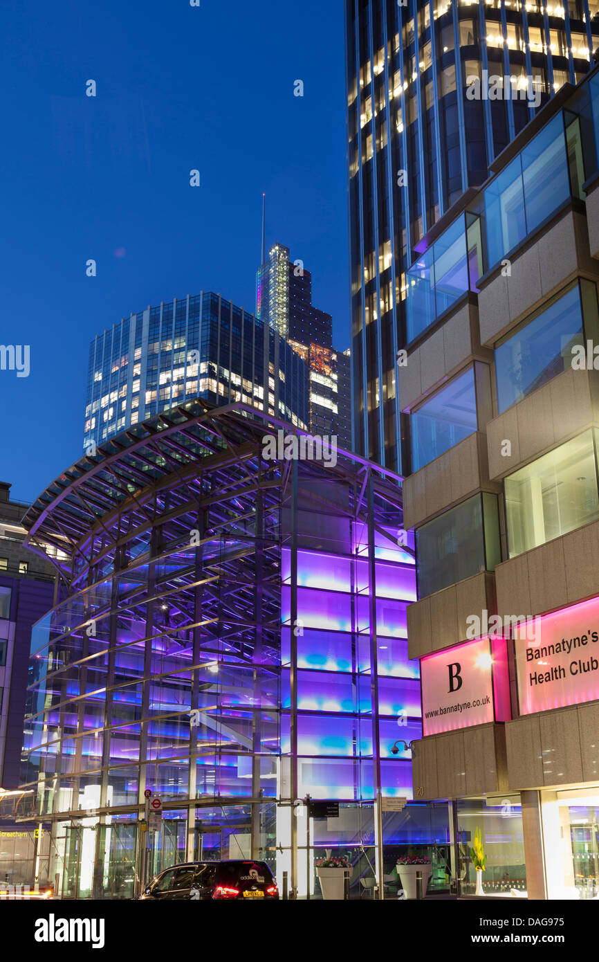 Modern office buildings in The City of London at night,Old Broad Street,England Stock Photo