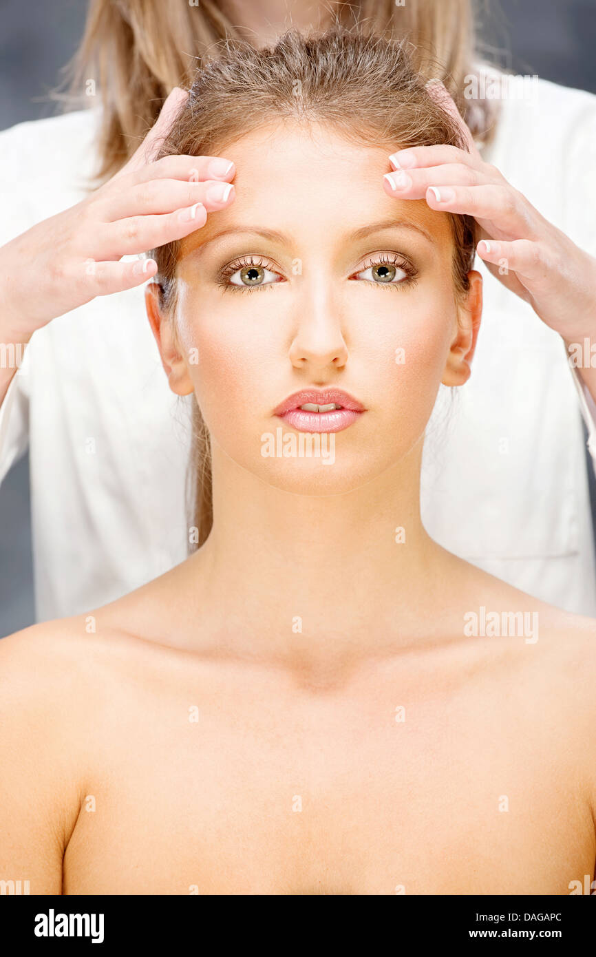 Pretty woman on head massage treatment Stock Photo
