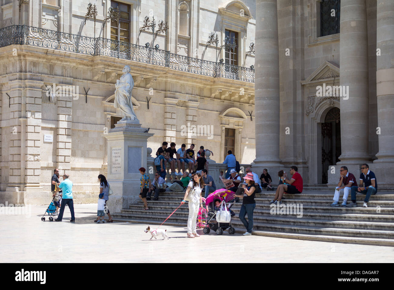 Italy, Sicily, Siracusa, Ortigia, Piazza del Duomo, people on the Cathedral stair Stock Photo