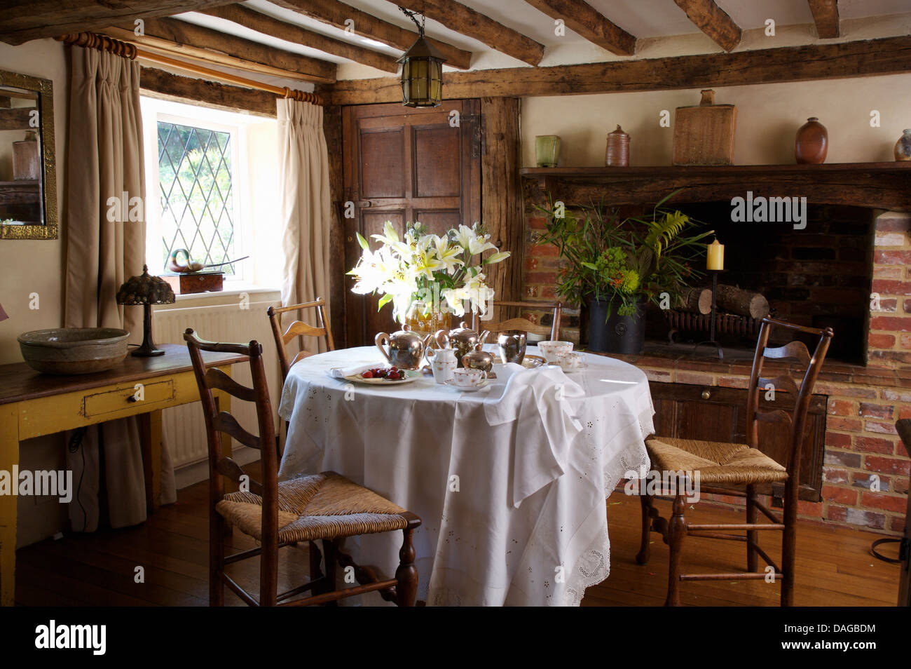 Antique Rush Seated Ladder Back Chairs At Table Set For Tea