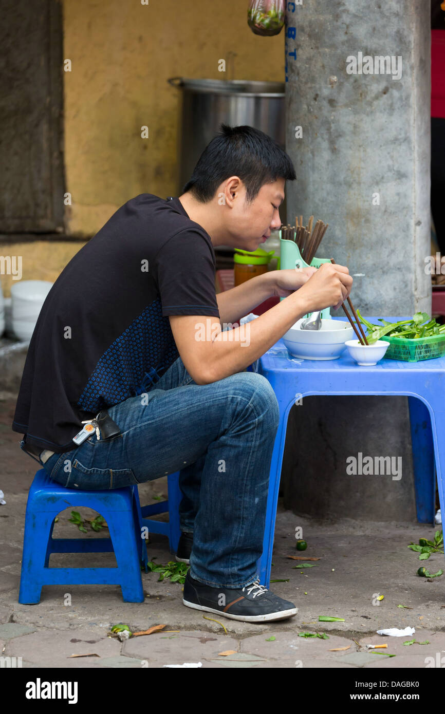 Vietnamese Man in the Streets of the Old Quarter in Hanoi, Vietnam ...