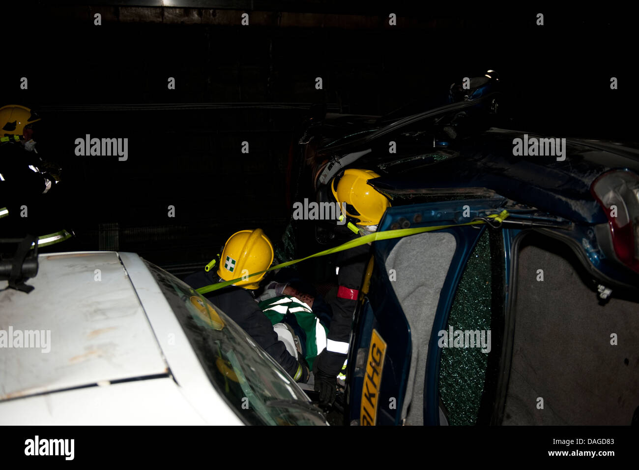 Firefighters at Car Crash at night RTC RTA Stock Photo
