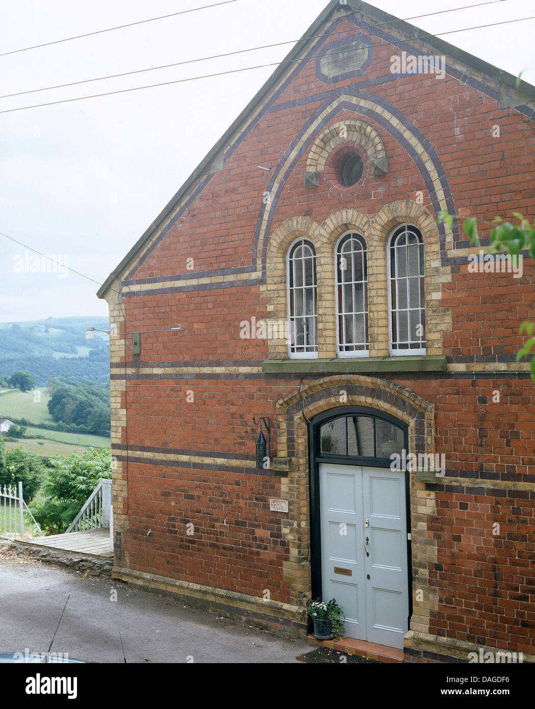 Exterior Of A Converted Victorian Chapel With Arched Windows