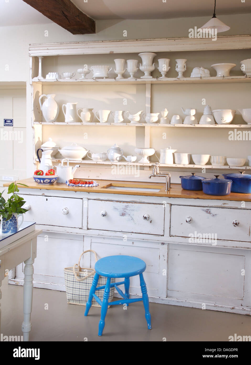 White China Displayed On Shelves Above Sink In White Built In