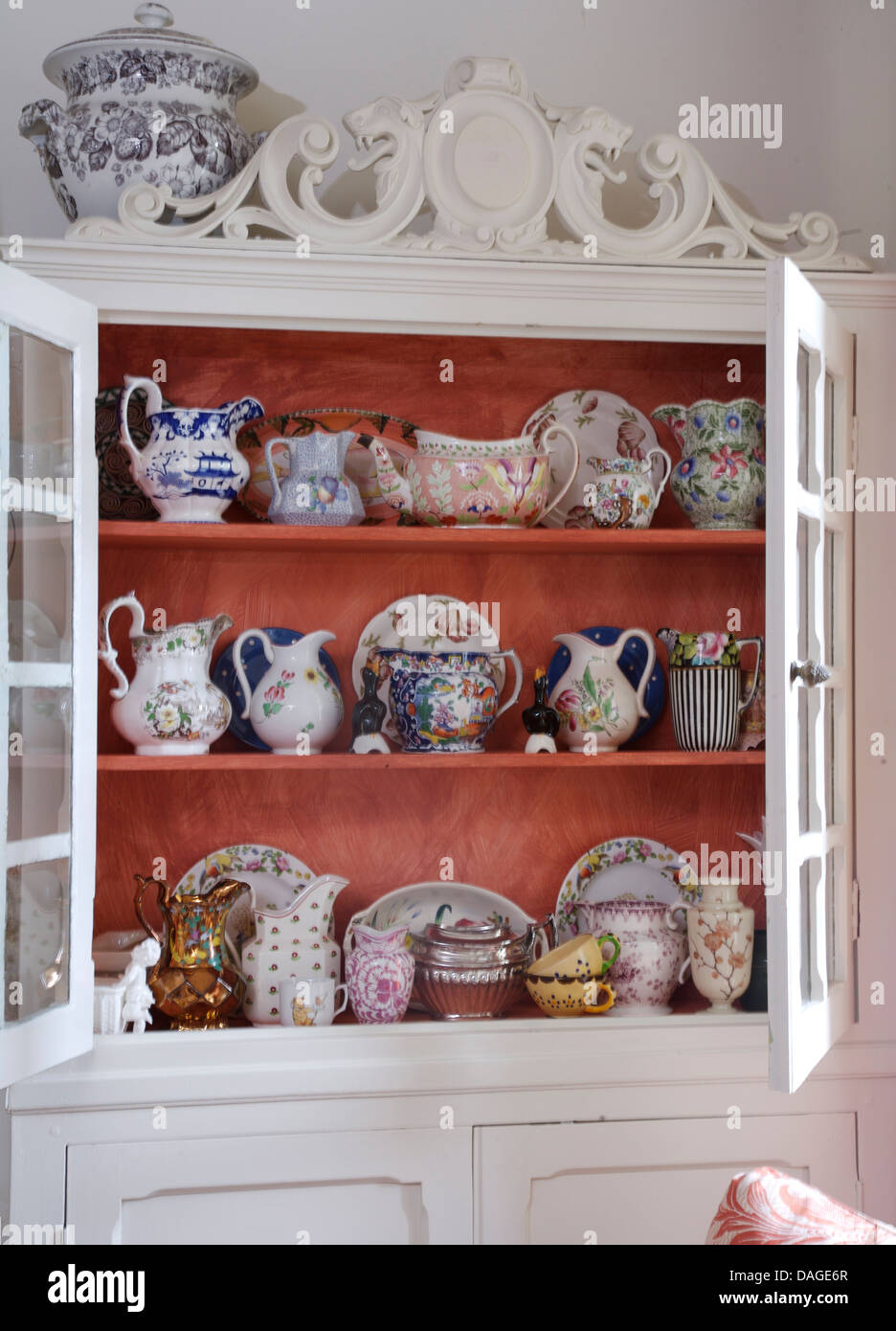Close Up Of White Painted Dresser With Collection Of Antique Jugs