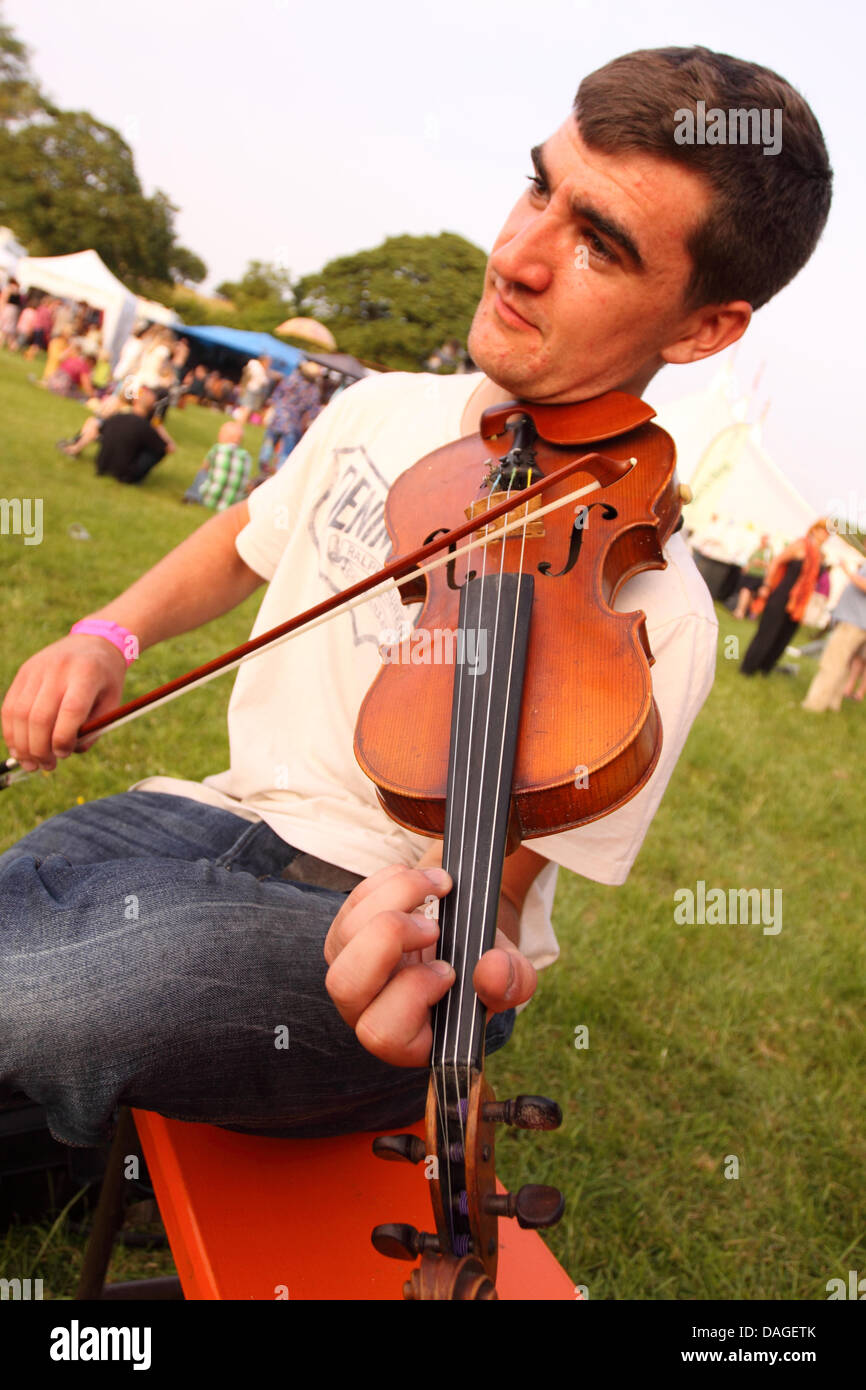 Priddy Folk Festival, Somerset, UK. July 2013. Musicians play live music in the summer evening sun at the Priddy Folk Festival Stock Photo