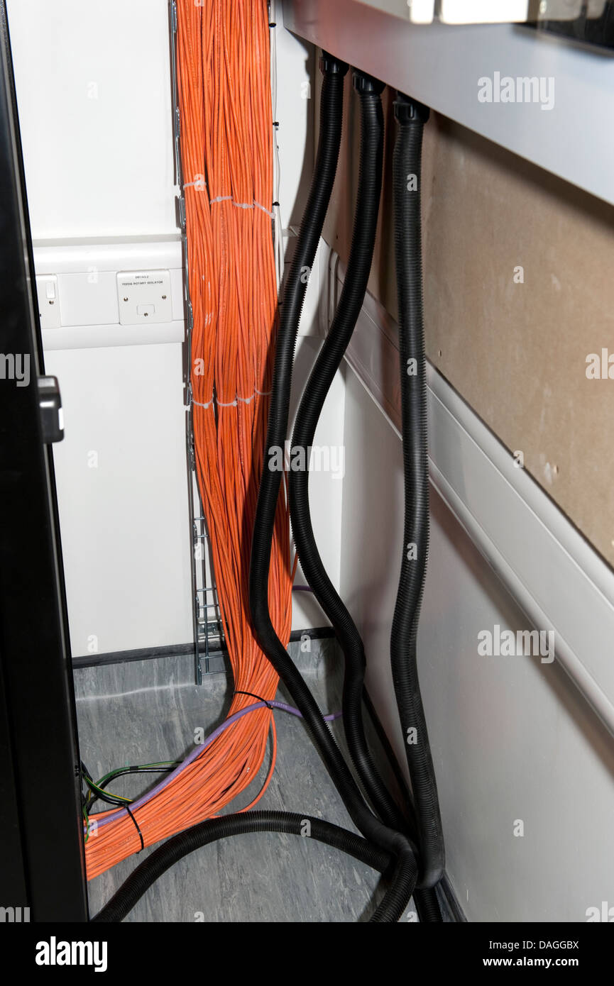 Fibre Optic Data and power cabling in server room Stock Photo