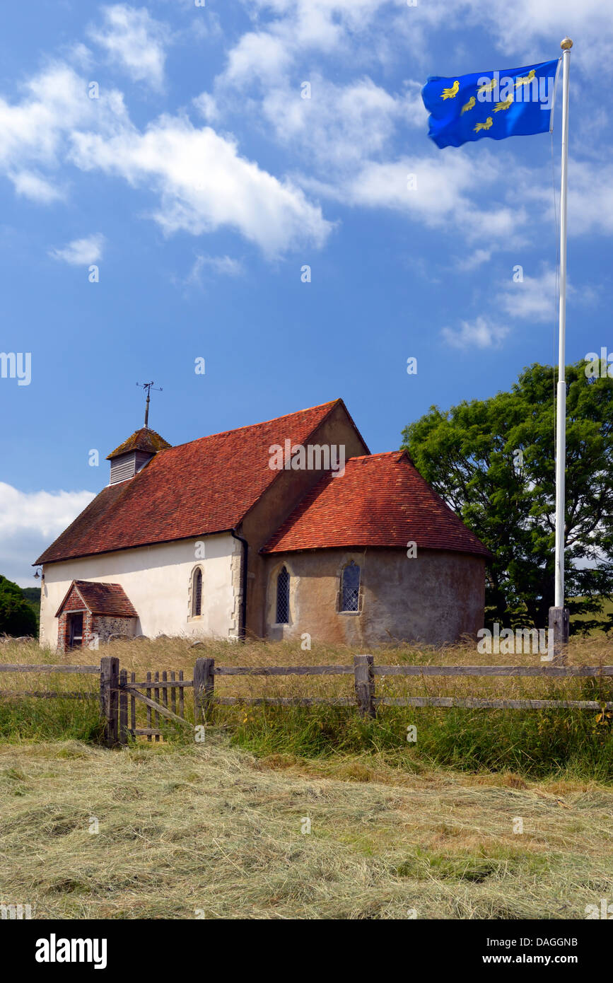 The Church of Saint Mary the Virgin at Upwaltham flying the Sussex Martlets Flag, South Downs National Park Stock Photo