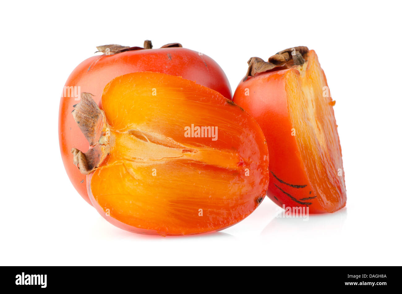 Ripe persimmons on white background Stock Photo - Alamy