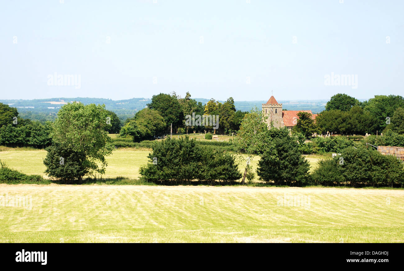 Rural landscape with mown fields and historic church in Kent, England Stock Photo