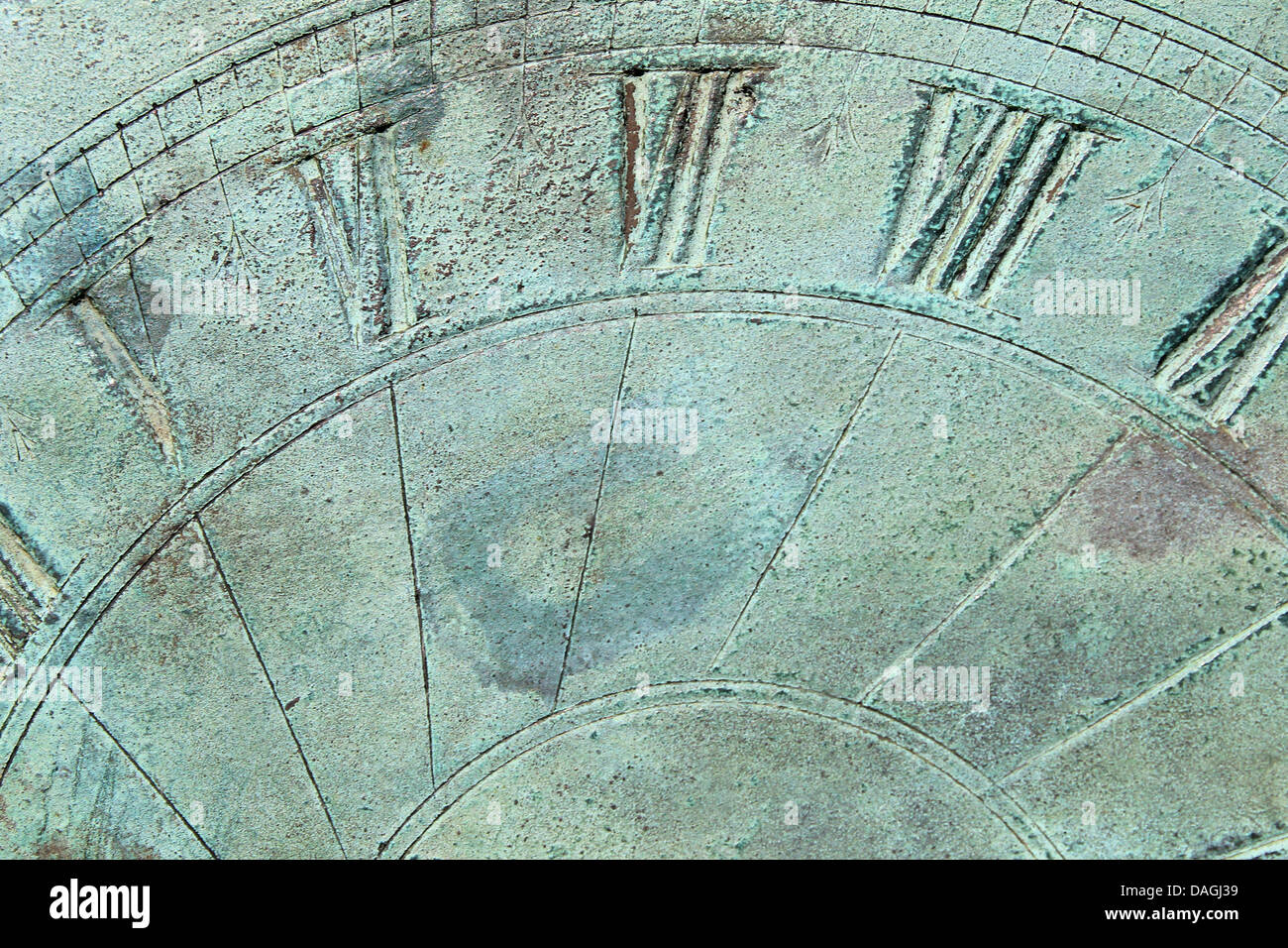 Abstract background showing textured surface of sun dial. Stock Photo