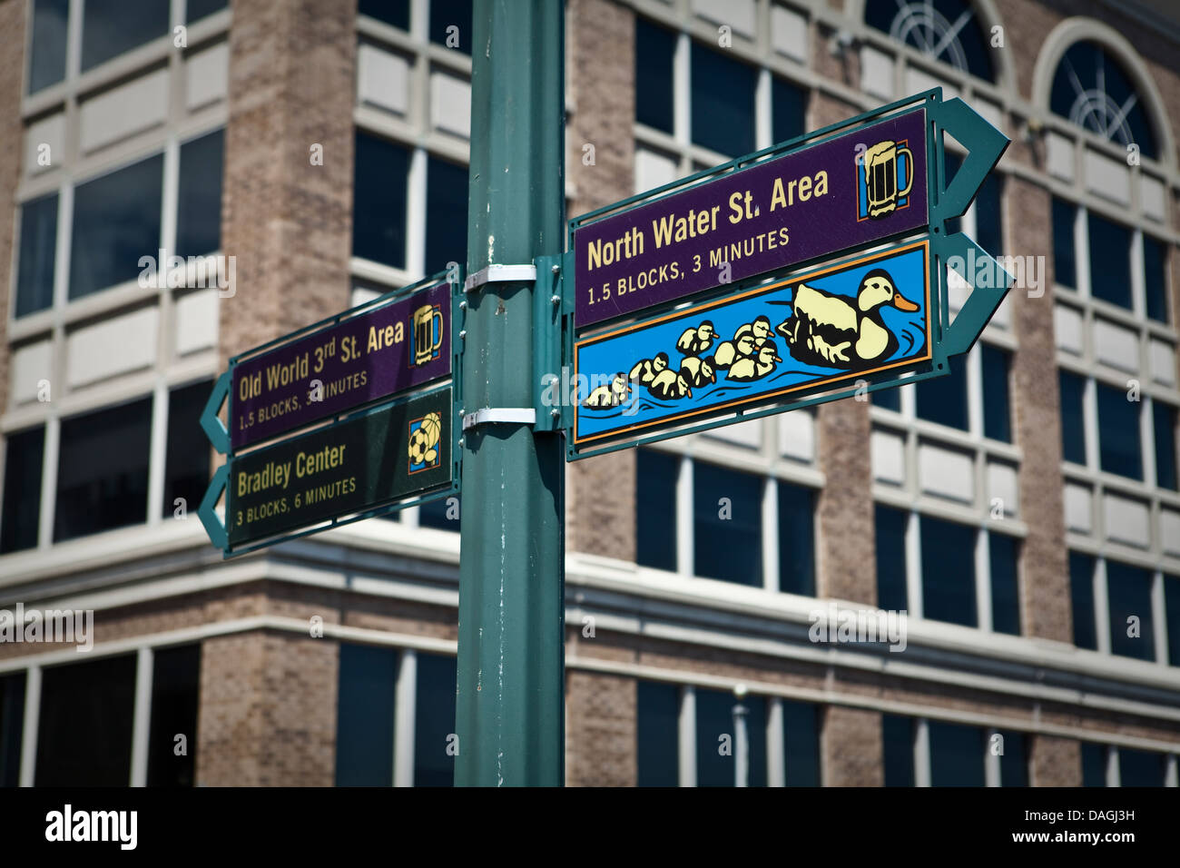 A sign pointing to Old World 3rd St. Area, Bradley Center and North Water St. Area is seen in Milwaukee Stock Photo
