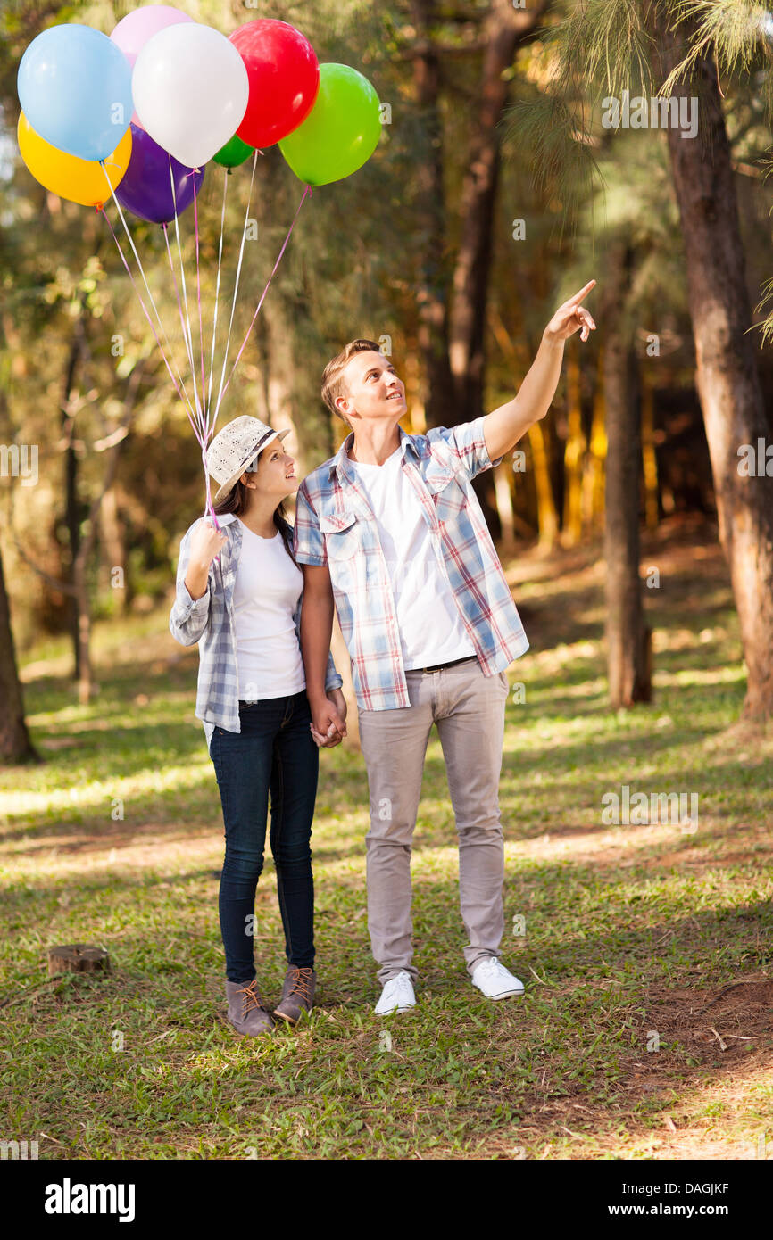 cute teen couple in the forest Stock Photo