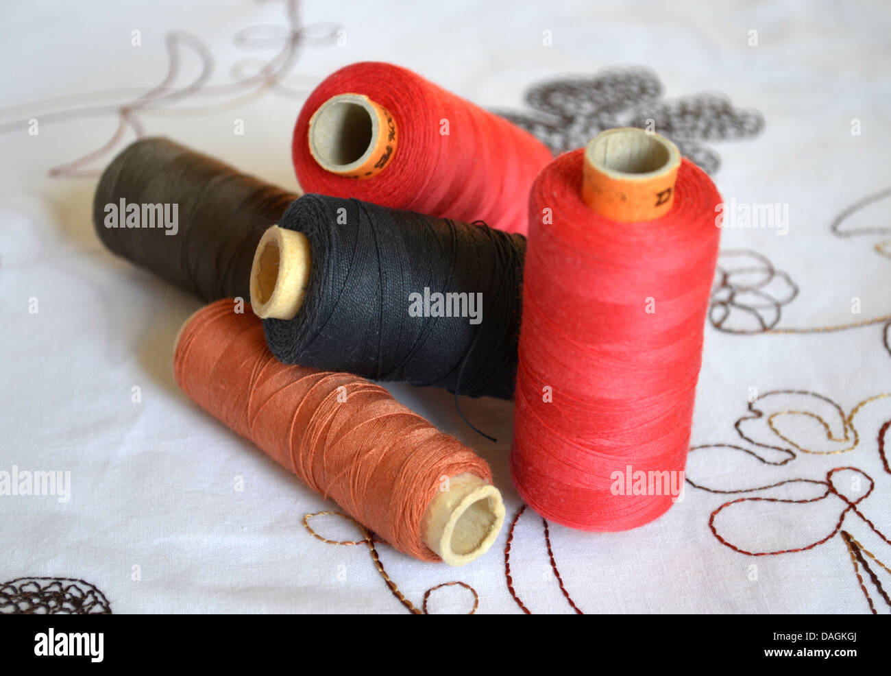 Various threads on decorative background Stock Photo - Alamy