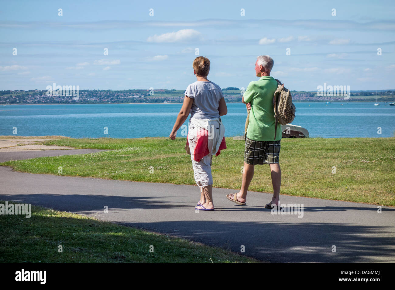 Middle Aged Couple Walking Strolling Langstone Harbour Hayling Island Stock Photo