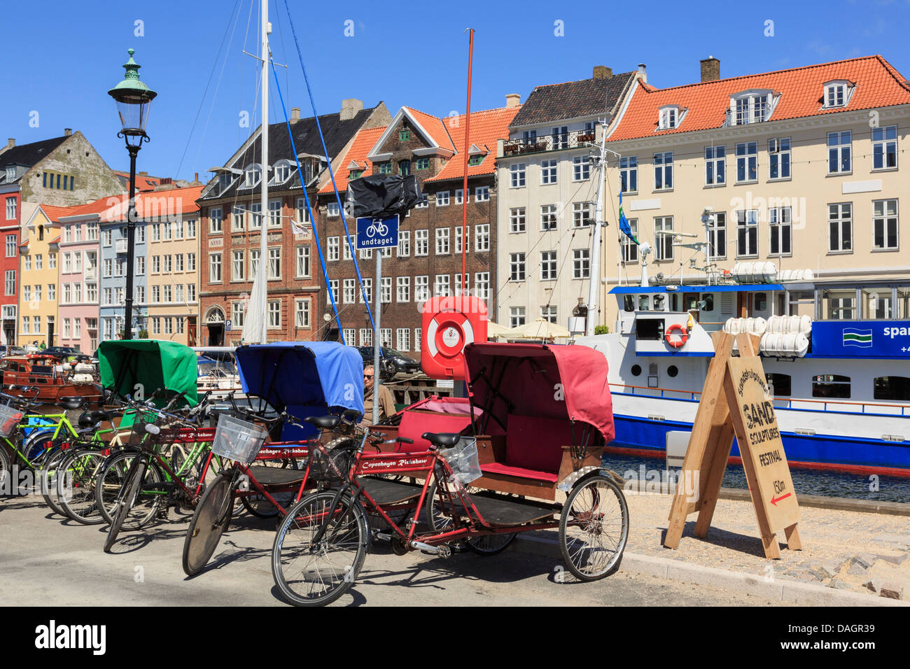 Tricycle rickshaws for city sightseeing tours in Nyhavn, Copenhagen, Zealand, Denmark Stock Photo