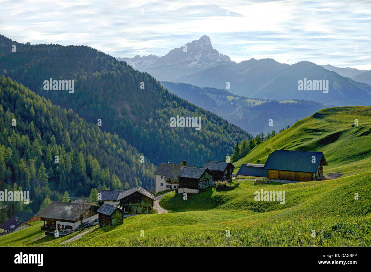 hamlet on mountain slope, Peitlerkofel in background, Italy, South Tyrol, Dolomites Stock Photo